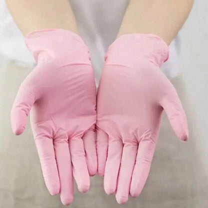 Gants en nitrile roses pour professionnelles de la beauté.