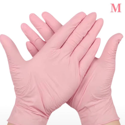 Gants en nitrile roses pour professionnelles de la beauté.